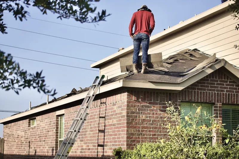 Professional roofer working on a residential roof in Tahoe Pines